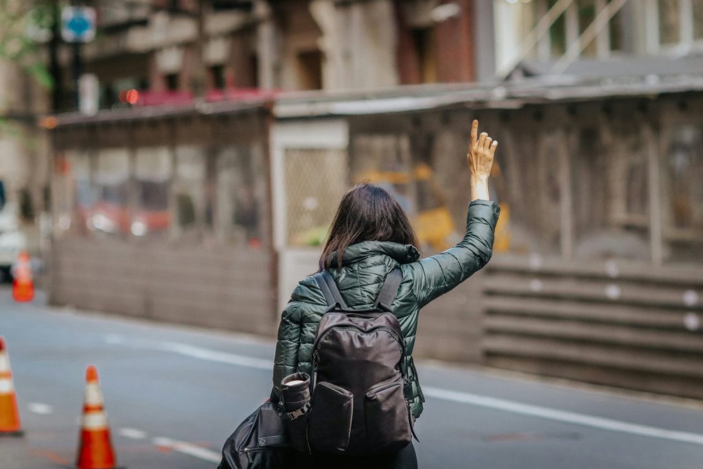 a woman with her hand up in the air
